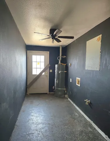 a view of backyard of house with green space