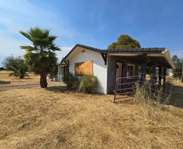 a view of a house with a iron gate