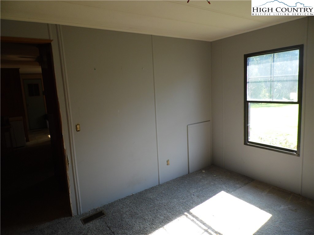1475 Ferguson Drive Clemmons, NC 27012 - Photo 13 of 35 an empty room with windows