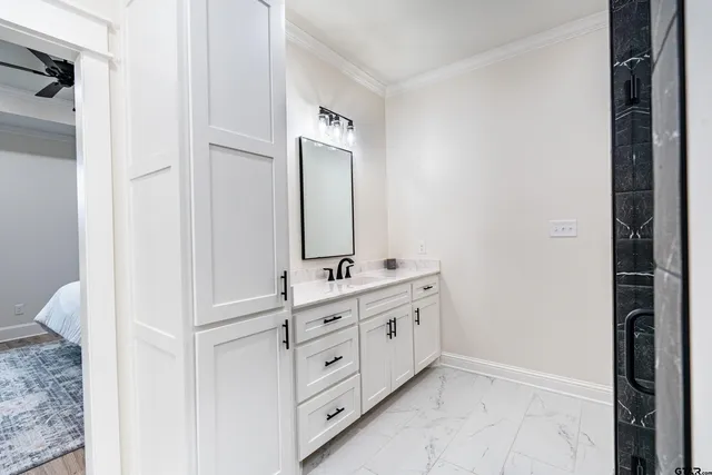 a bathroom with a double vanity sink and mirror