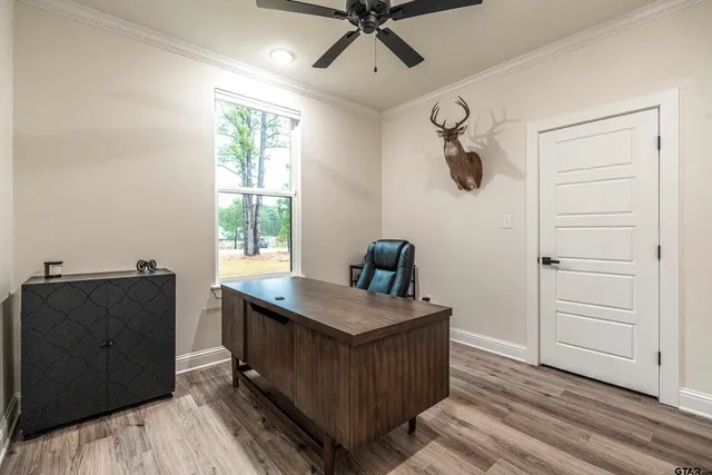 a kitchen with a table and chairs
