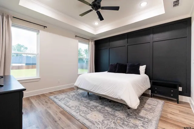 a bedroom with a large bed and a window