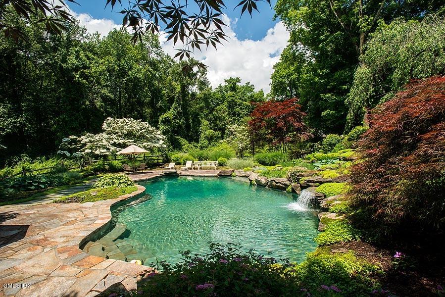 163 Clapboard Ridge Road Greenwich, CT 06831 - Photo 11 of 17 a view of a garden with a lake