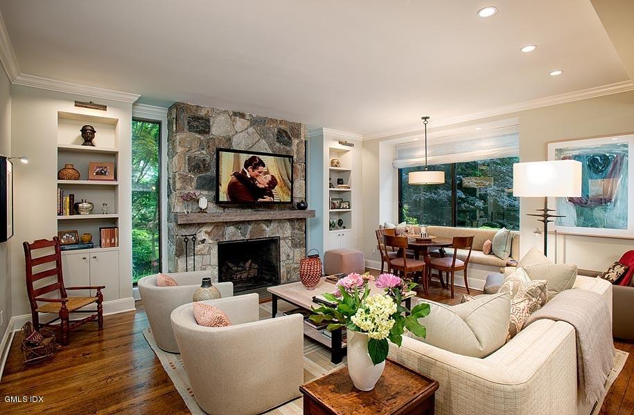163 Clapboard Ridge Road Greenwich, CT 06831 - Photo 7 of 17 a living room with furniture potted plant and a fireplace