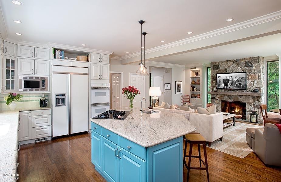 163 Clapboard Ridge Road Greenwich, CT 06831 - Photo 8 of 17 a kitchen with cabinets a counter and chairs