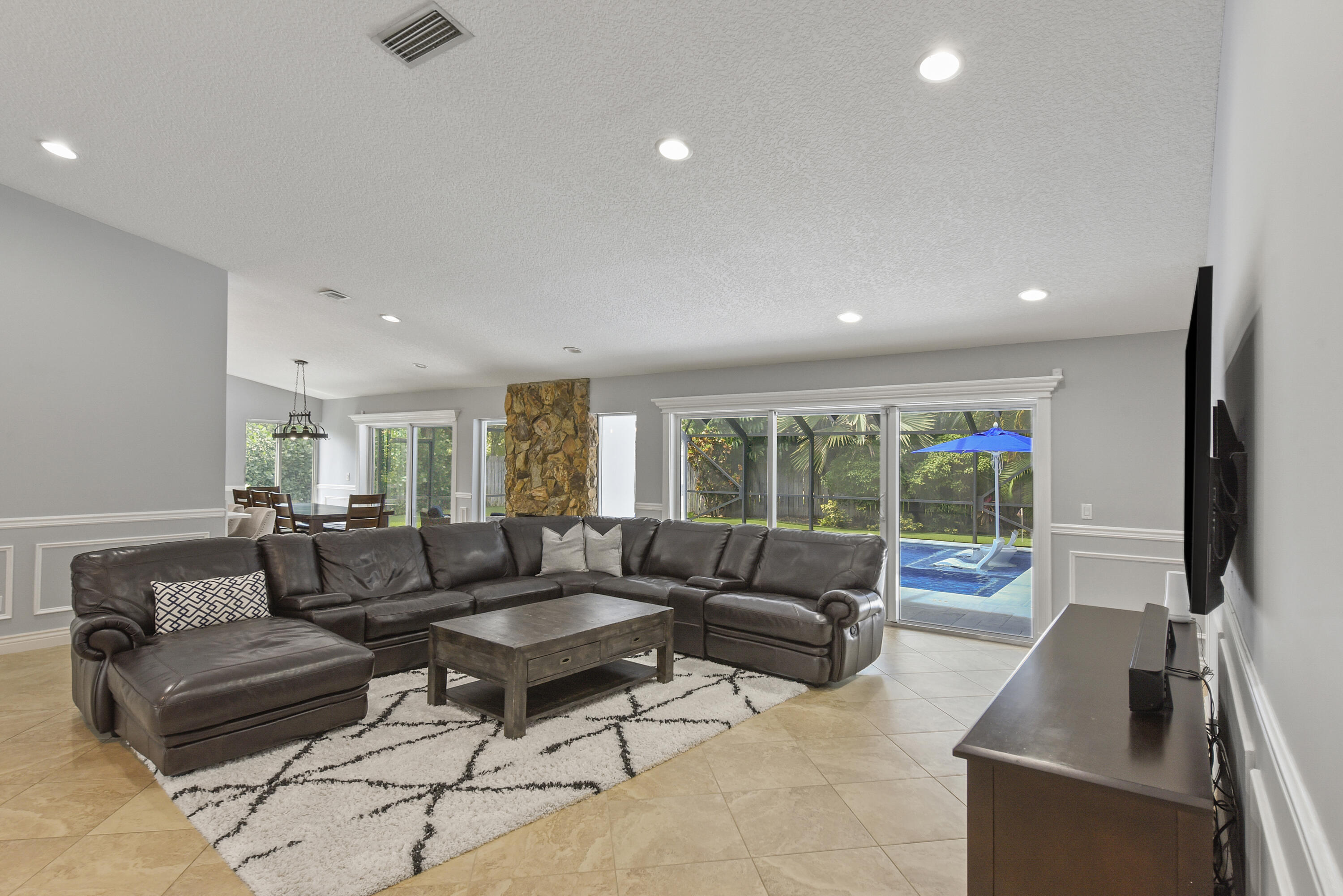 2659 Northwest 26th Circle Boca Raton, FL 33431 - Photo 11 of 34 a living room with furniture and a flat screen tv