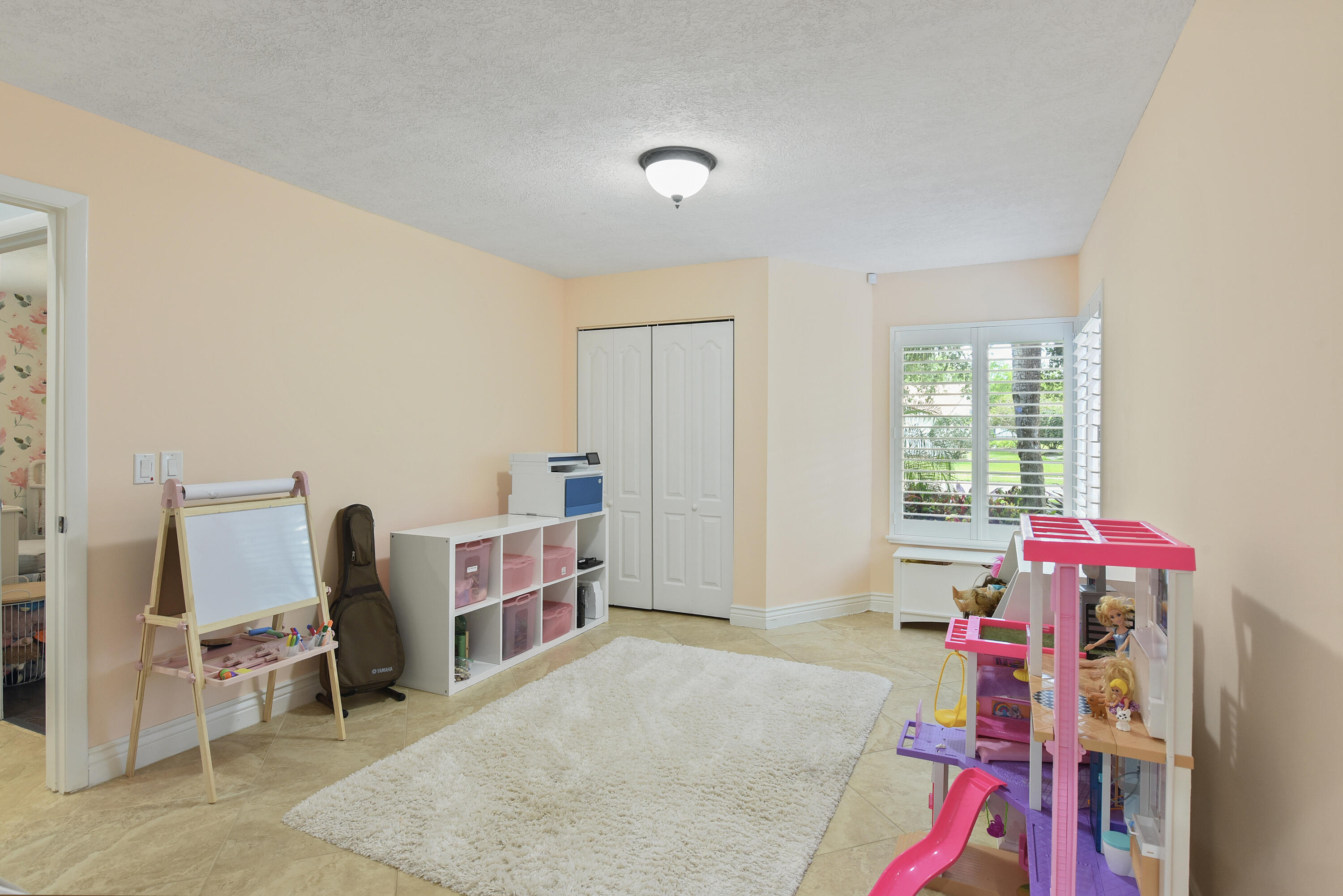 2659 Northwest 26th Circle Boca Raton, FL 33431 - Photo 14 of 34 a living room with furniture and a flat screen tv