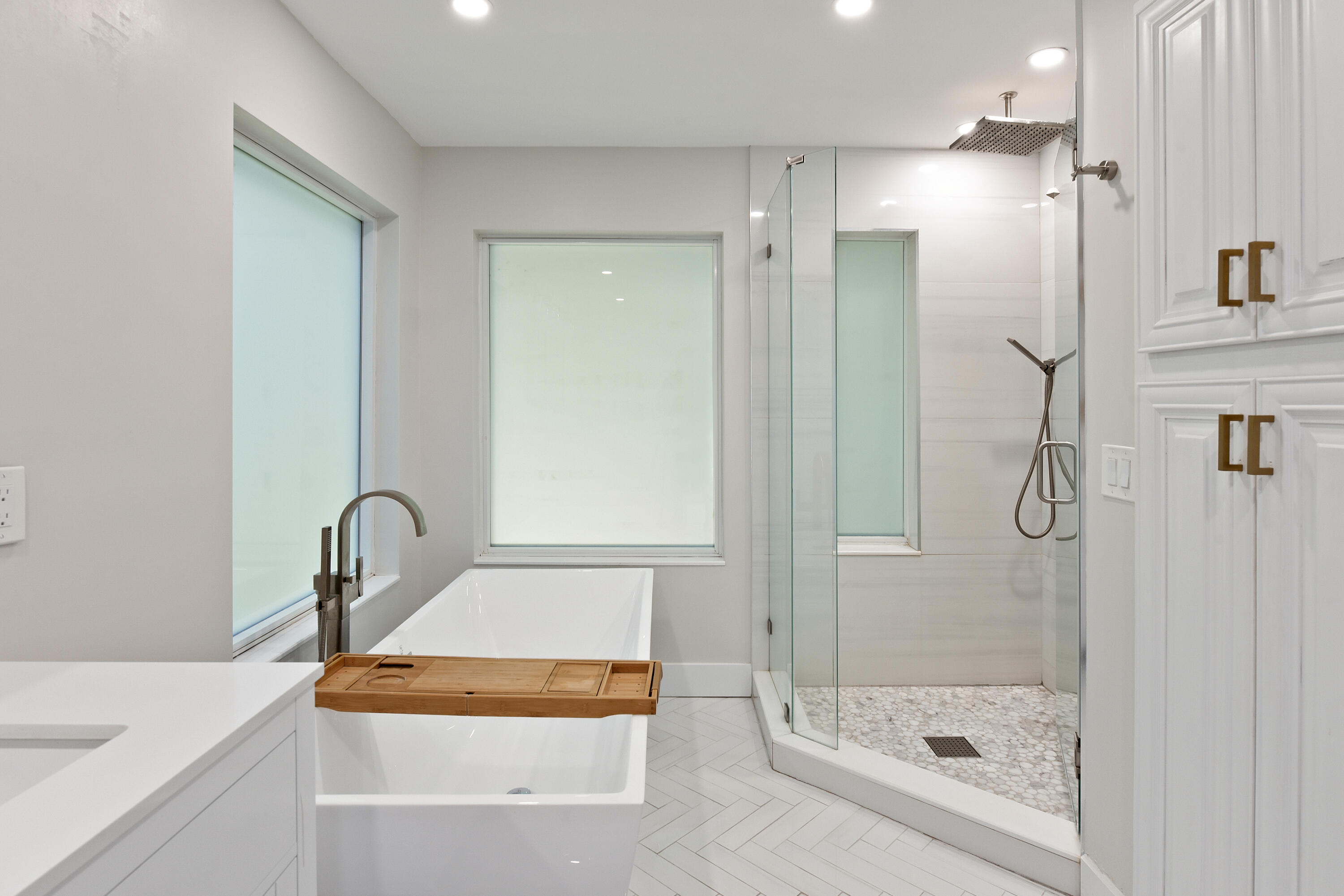 2659 Northwest 26th Circle Boca Raton, FL 33431 - Photo 18 of 34 a bathroom with a sink and shower