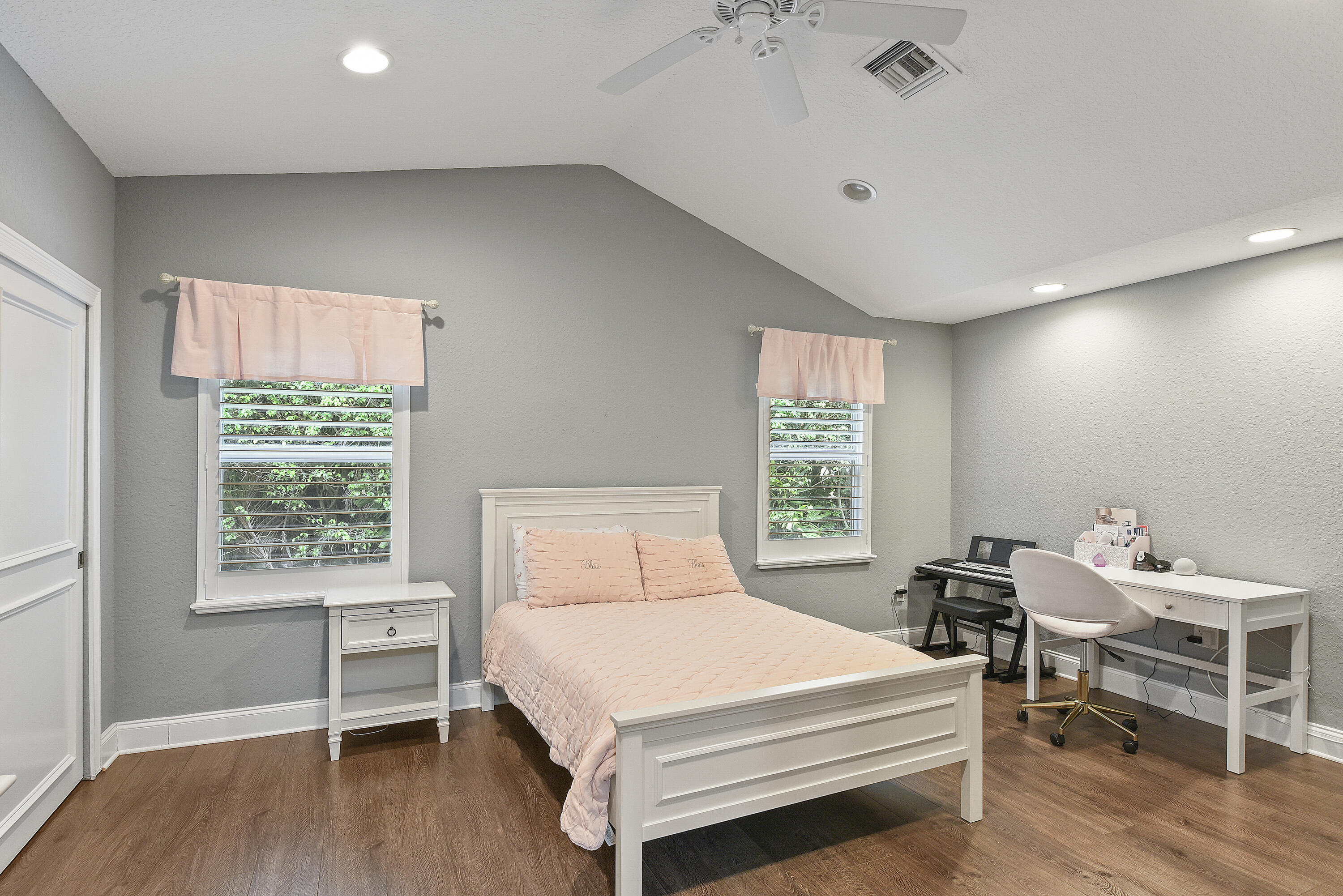 2659 Northwest 26th Circle Boca Raton, FL 33431 - Photo 21 of 34 a bedroom with a bed and a window