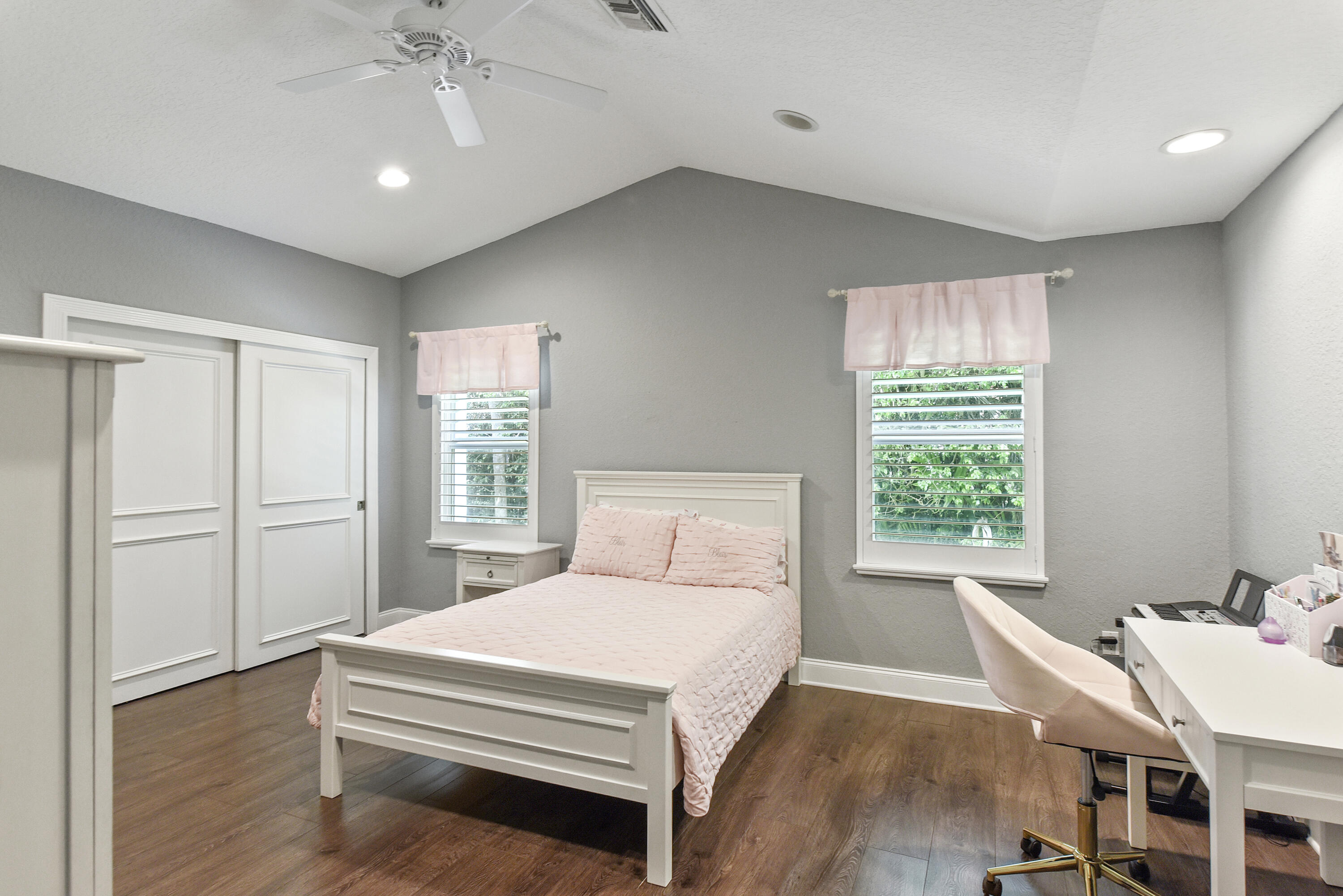 2659 Northwest 26th Circle Boca Raton, FL 33431 - Photo 23 of 34 a bedroom with a bed and a table