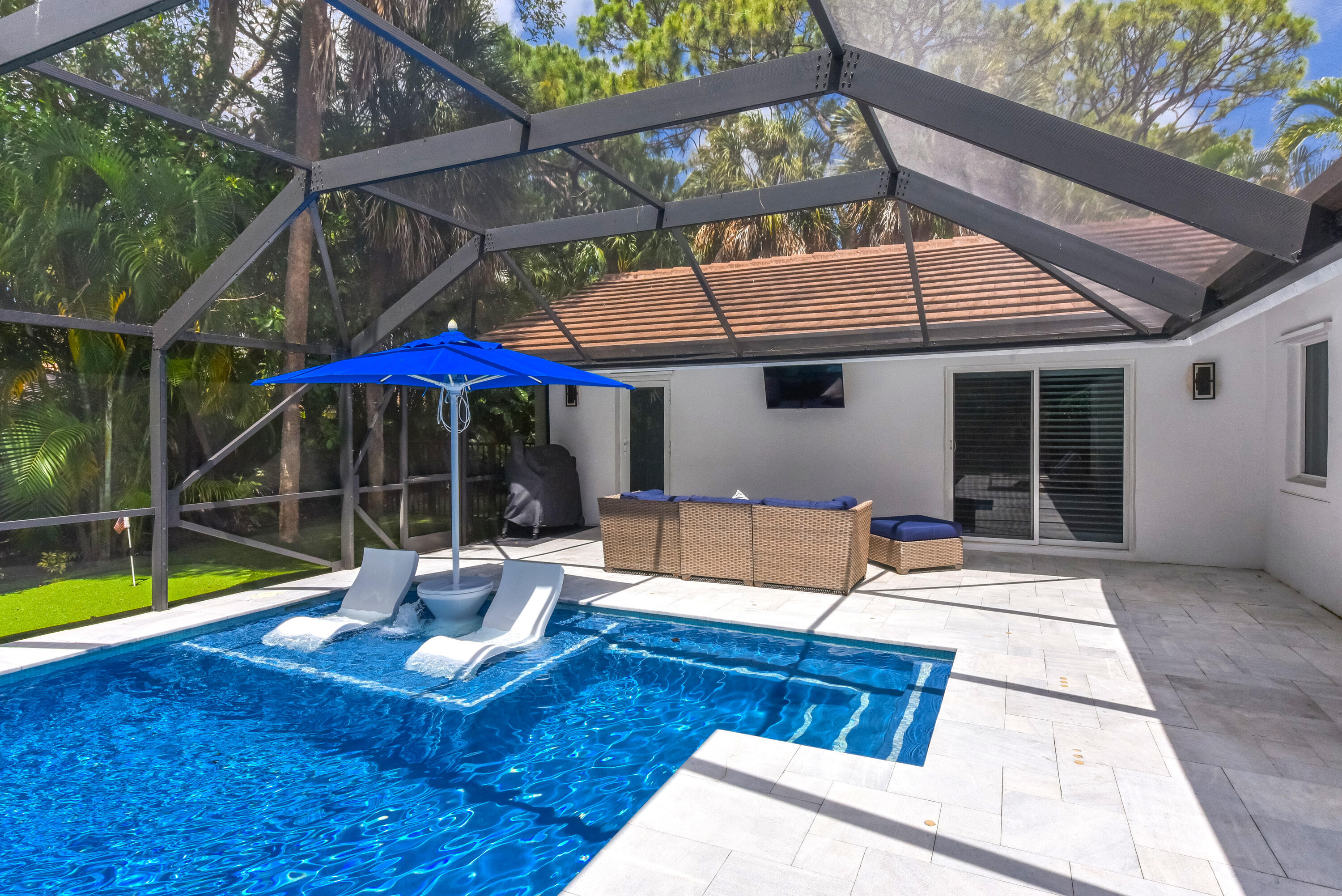 2659 Northwest 26th Circle Boca Raton, FL 33431 - Photo 26 of 34 a view of a house with swimming pool and sitting area