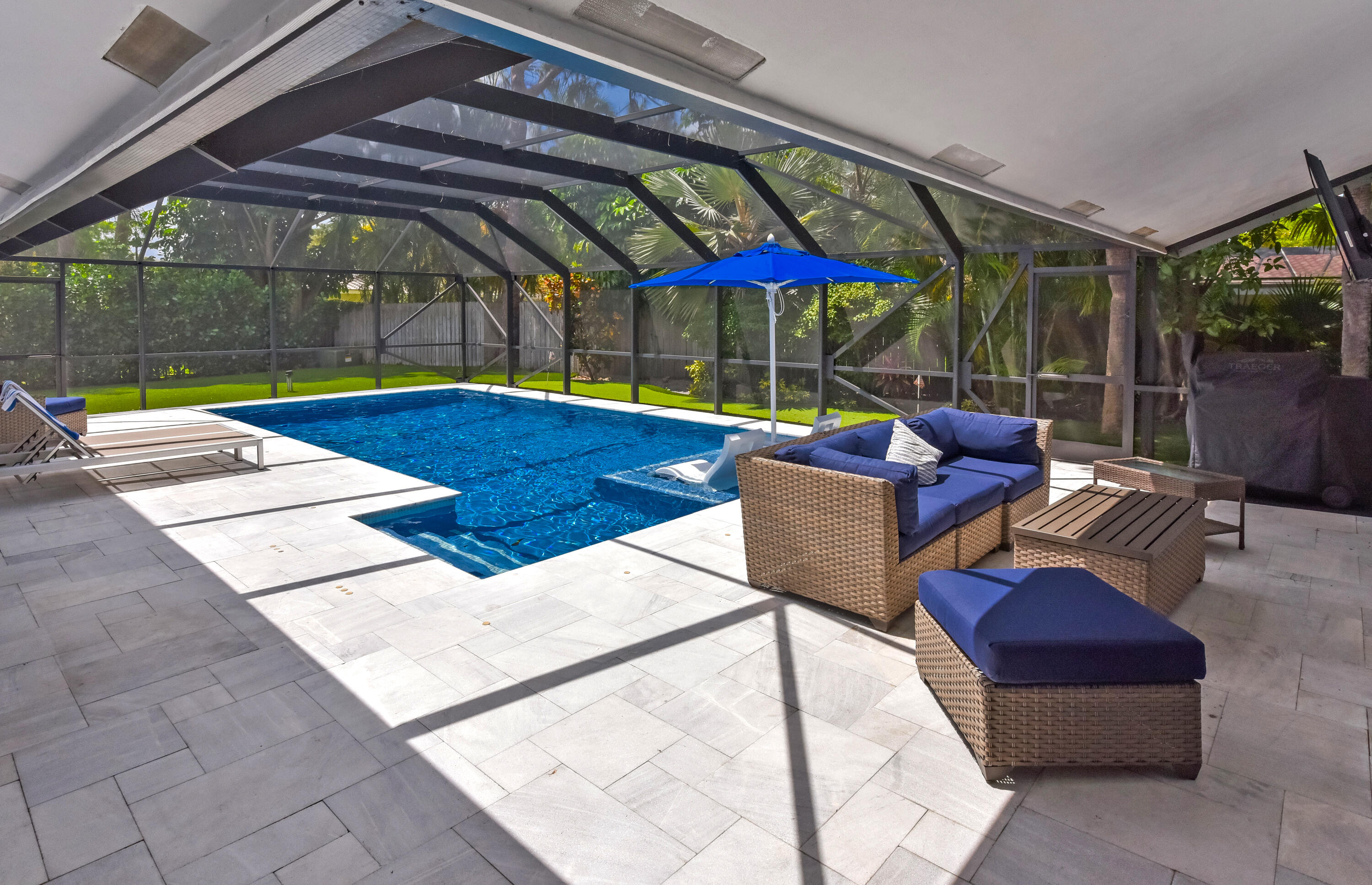 2659 Northwest 26th Circle Boca Raton, FL 33431 - Photo 28 of 34 a outdoor space with patio lots of white furniture and black umbrella