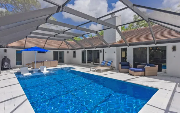 a view of swimming pool with a backyard
