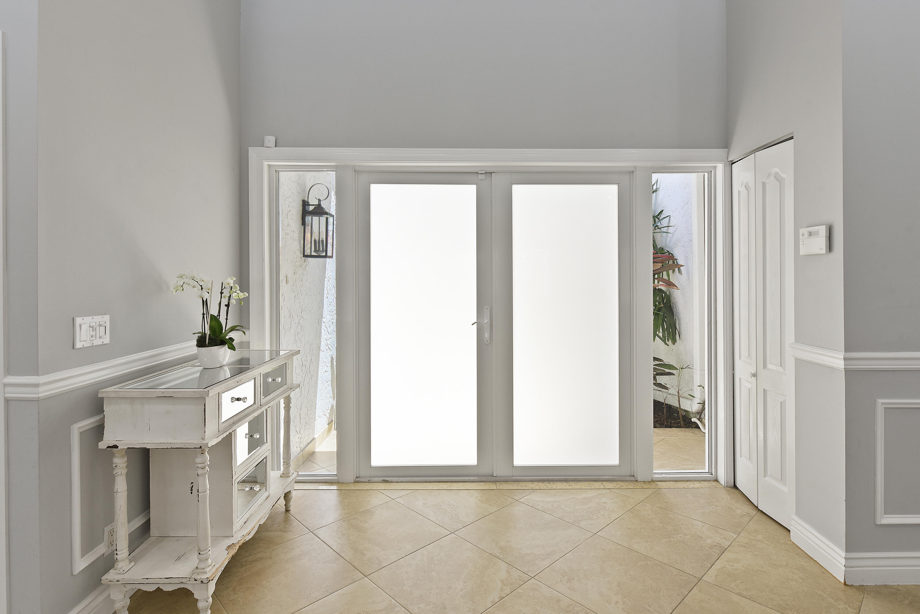 2659 Northwest 26th Circle Boca Raton, FL 33431 - Photo 4 of 34 a view of a hallway with furniture and a window