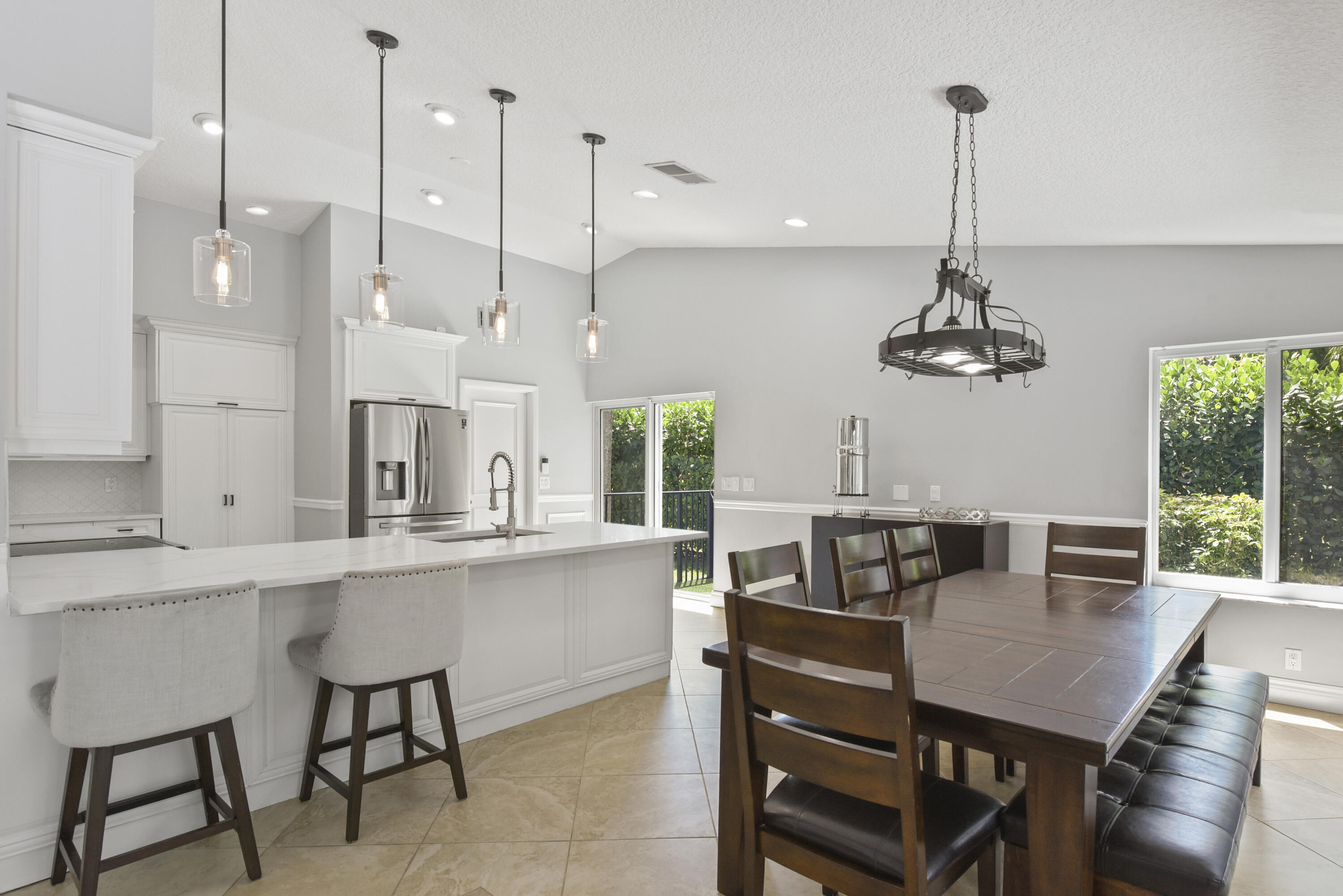 2659 Northwest 26th Circle Boca Raton, FL 33431 - Photo 6 of 34 a view of a dining room with furniture window and wooden floor