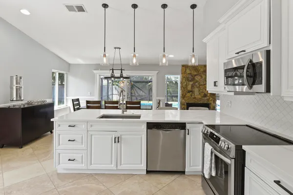 a kitchen with a sink and cabinets
