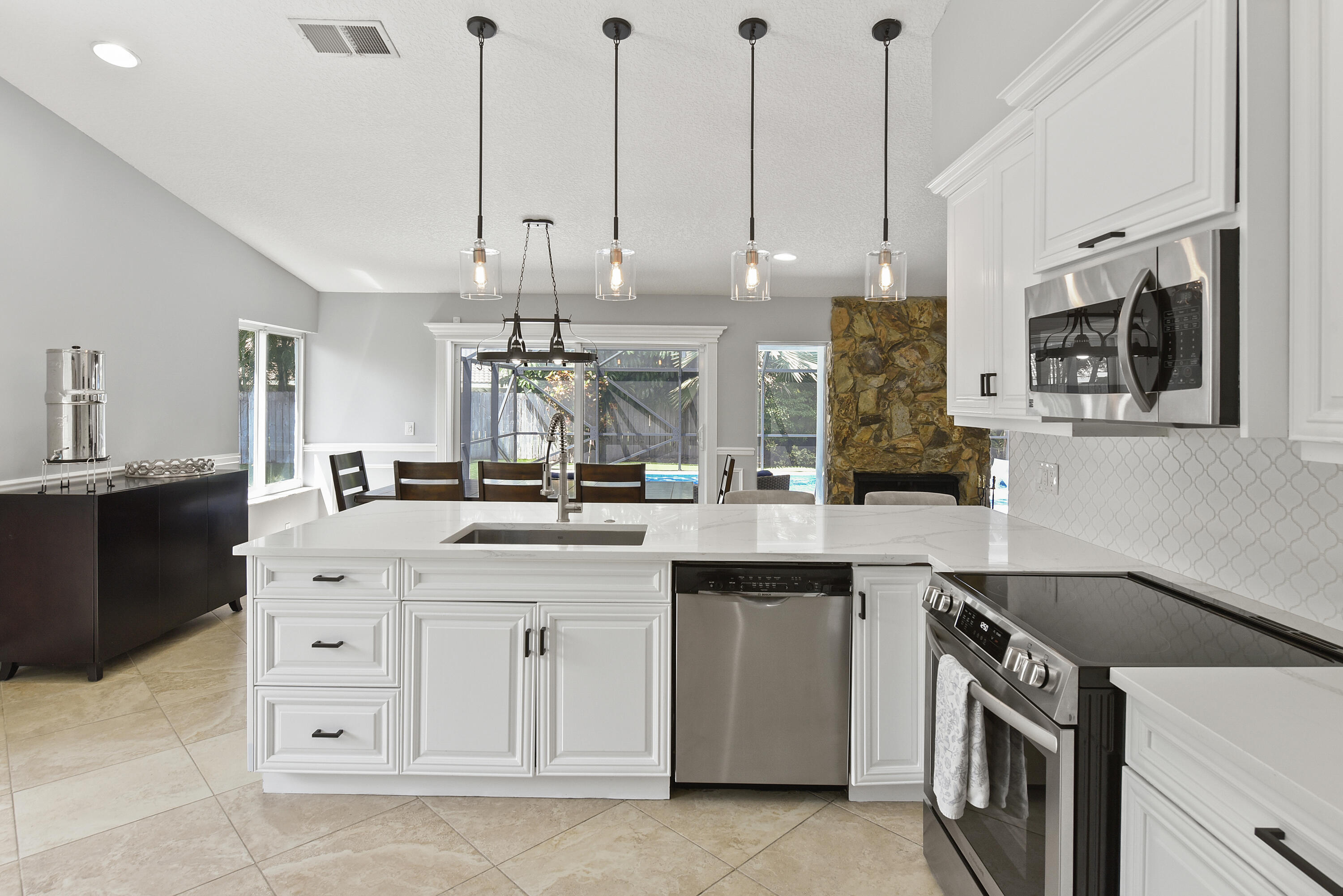 2659 Northwest 26th Circle Boca Raton, FL 33431 - Photo 8 of 34 a kitchen with a sink and cabinets