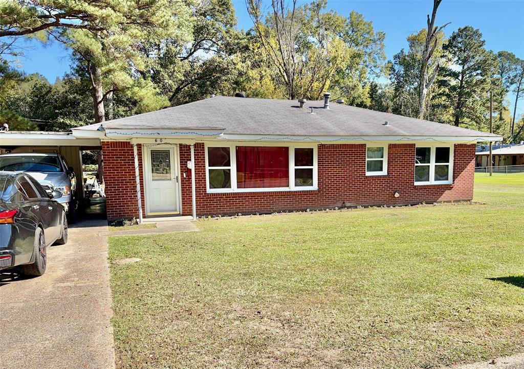 603 7th Street Southeast Springhill, LA 71075 - Photo 1 of 1 a front view of a house with yard
