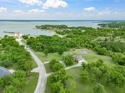 a view of a lake with a yard