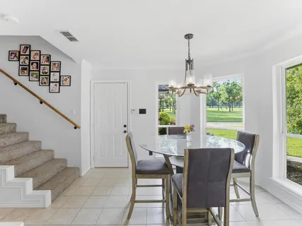a view of a dining room with furniture window and outside view