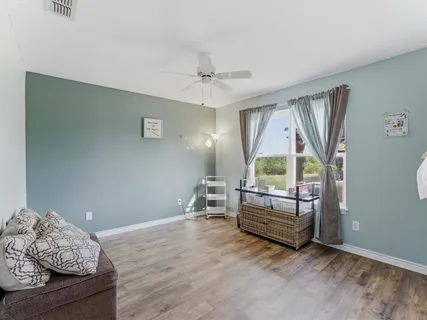 a bedroom with bed and window