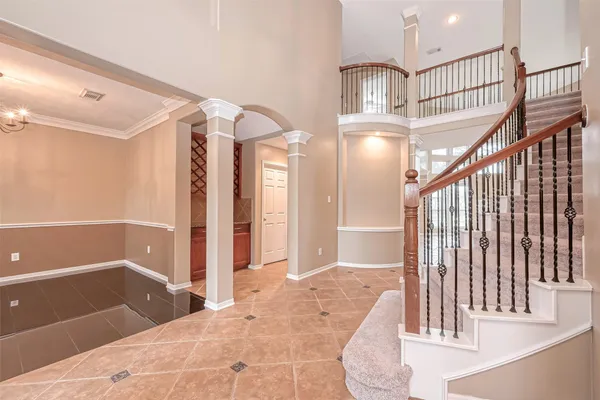 a view of staircase with white walls and railing