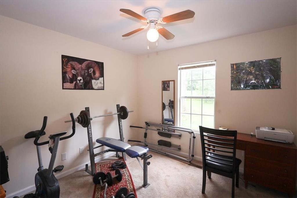 236 Hiram Sudie Road Dallas, GA 30157 - Photo 13 of 26 a view of a workspace with furniture and a window