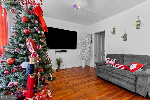 a living room with furniture and flowers