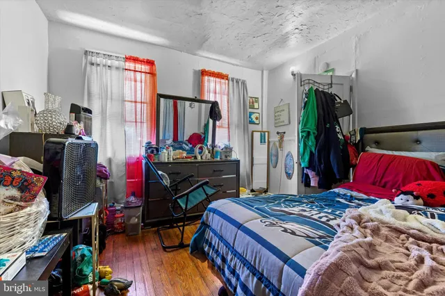 a bed room with a bed and a window