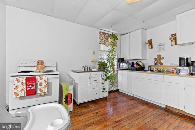 a room with furniture and a wooden floor