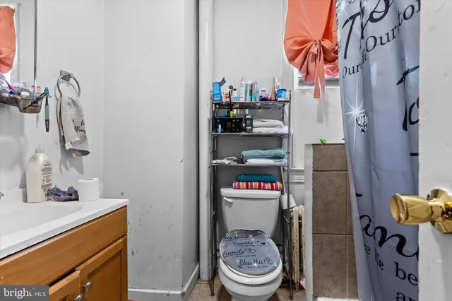 a bathroom with a toilet and a sink