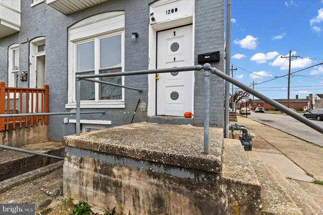 a view of a house with basketball court