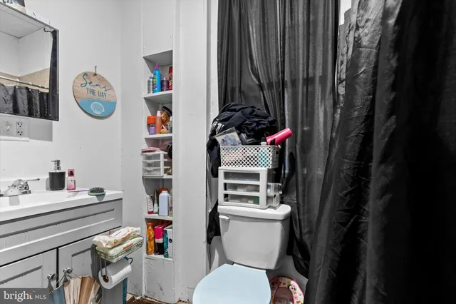 a bathroom with a toilet and a sink