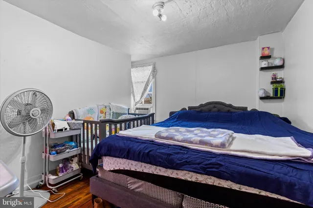 a bedroom with a bed and a closet