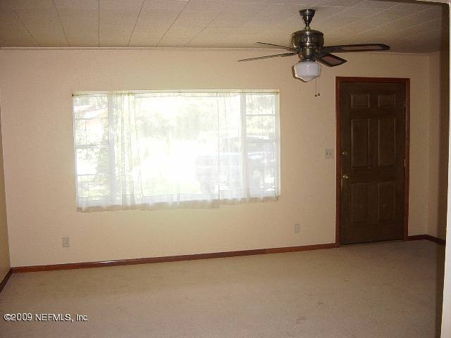 8820 Sanchez Road Jacksonville, FL 32217 - Photo 4 of 12 a view of an empty room with a window