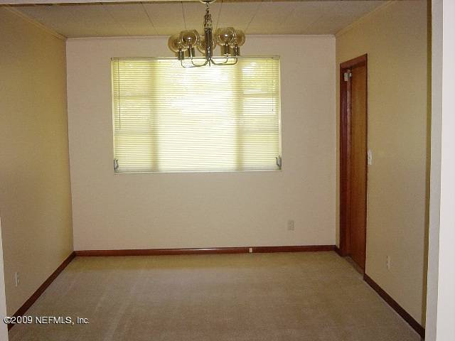 8820 Sanchez Road Jacksonville, FL 32217 - Photo 5 of 12 a view of an empty room with a window