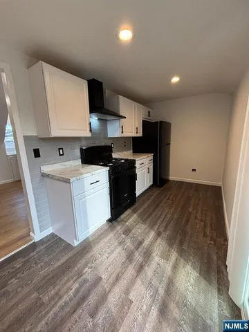 a kitchen with a sink a stove and refrigerator
