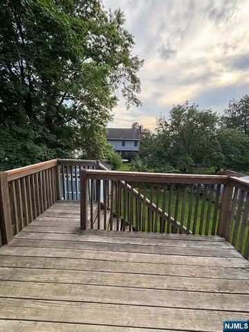 a balcony with trees in front of it