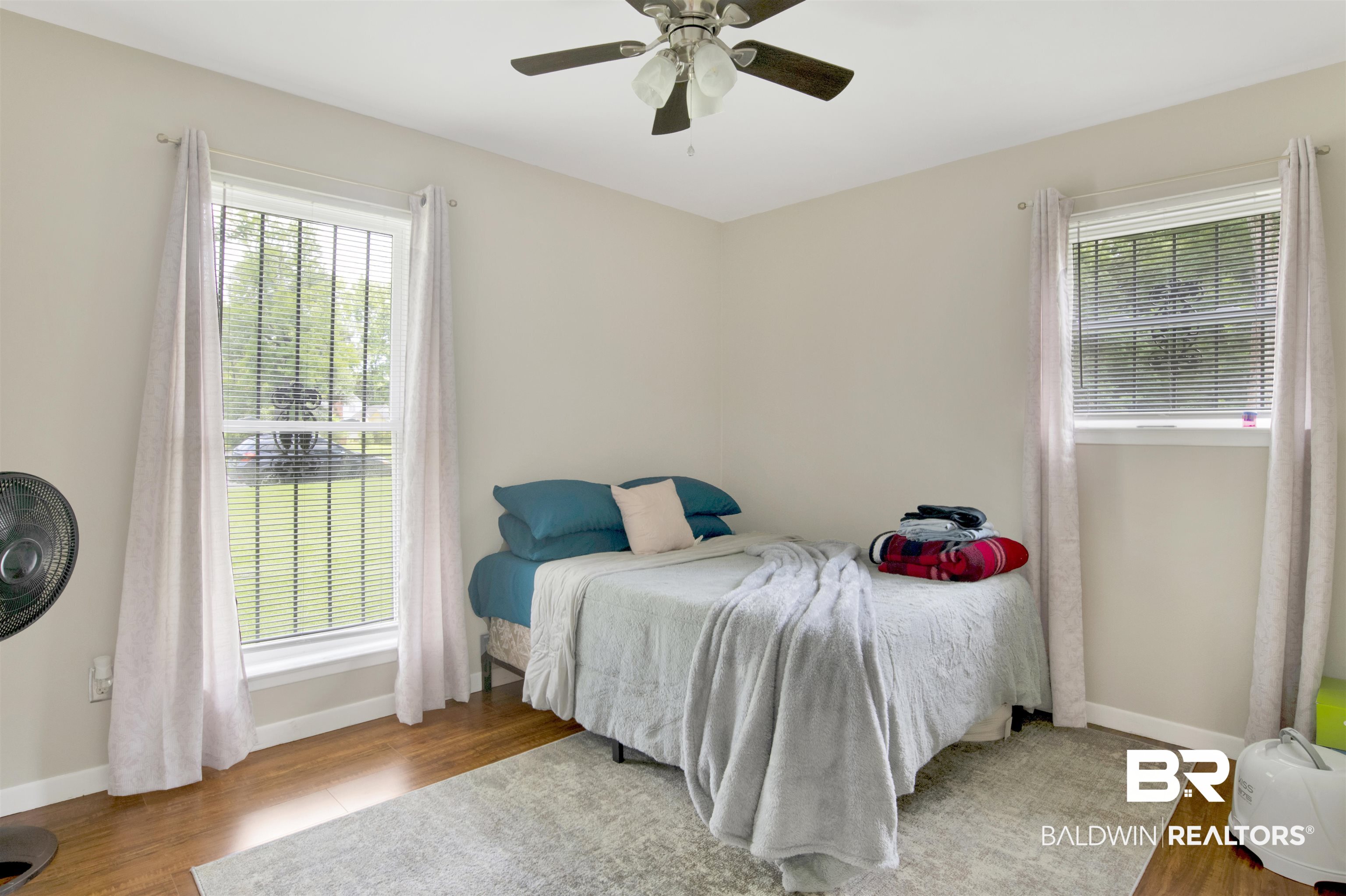 1476 Boudousquie Street Mobile, AL 36605 - Photo 20 of 34 Bedroom with wood finished floors and a ceiling fan