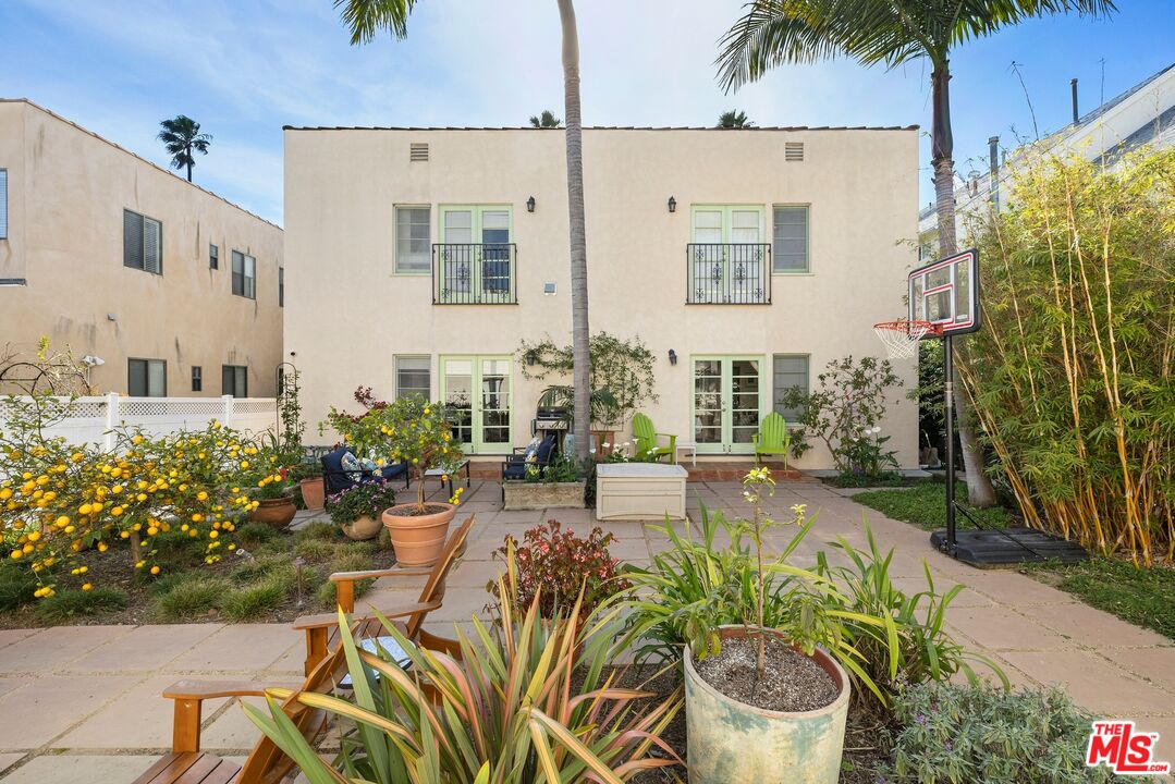 827 12th Street Santa Monica, CA 90403 - Photo 7 of 15 a view of a patio with table and chairs potted plants