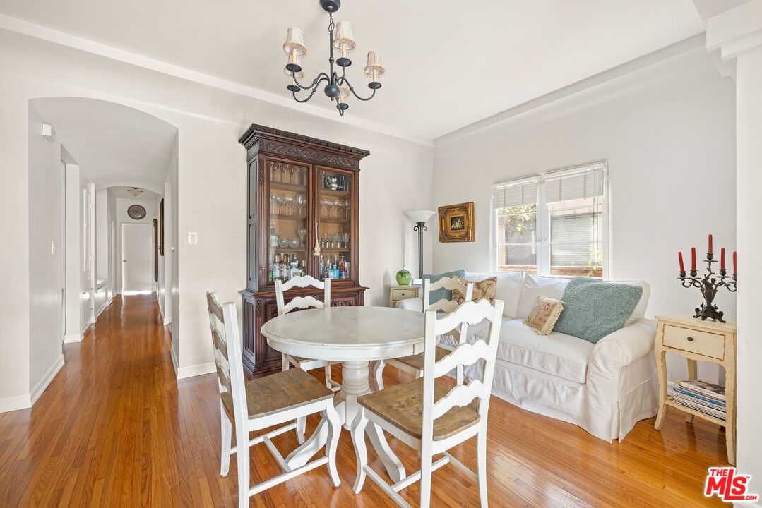 827 12th Street Santa Monica, CA 90403 - Photo 9 of 15 a living room with furniture and a chandelier