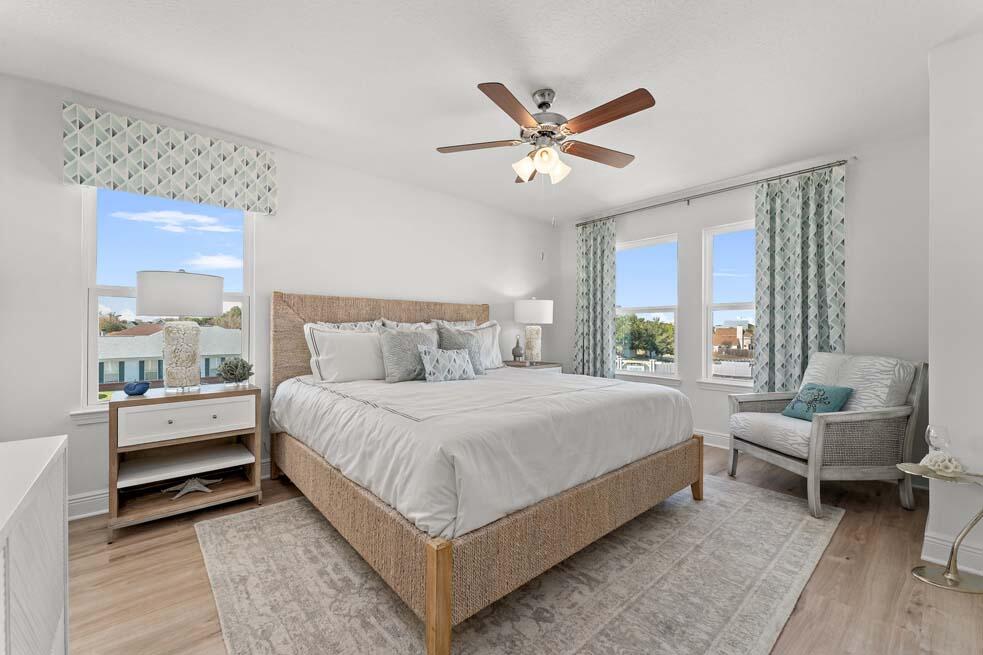 23 Redbird Loop Destin, FL 32541 - Photo 20 of 30 a bedroom with a bed and a chandelier