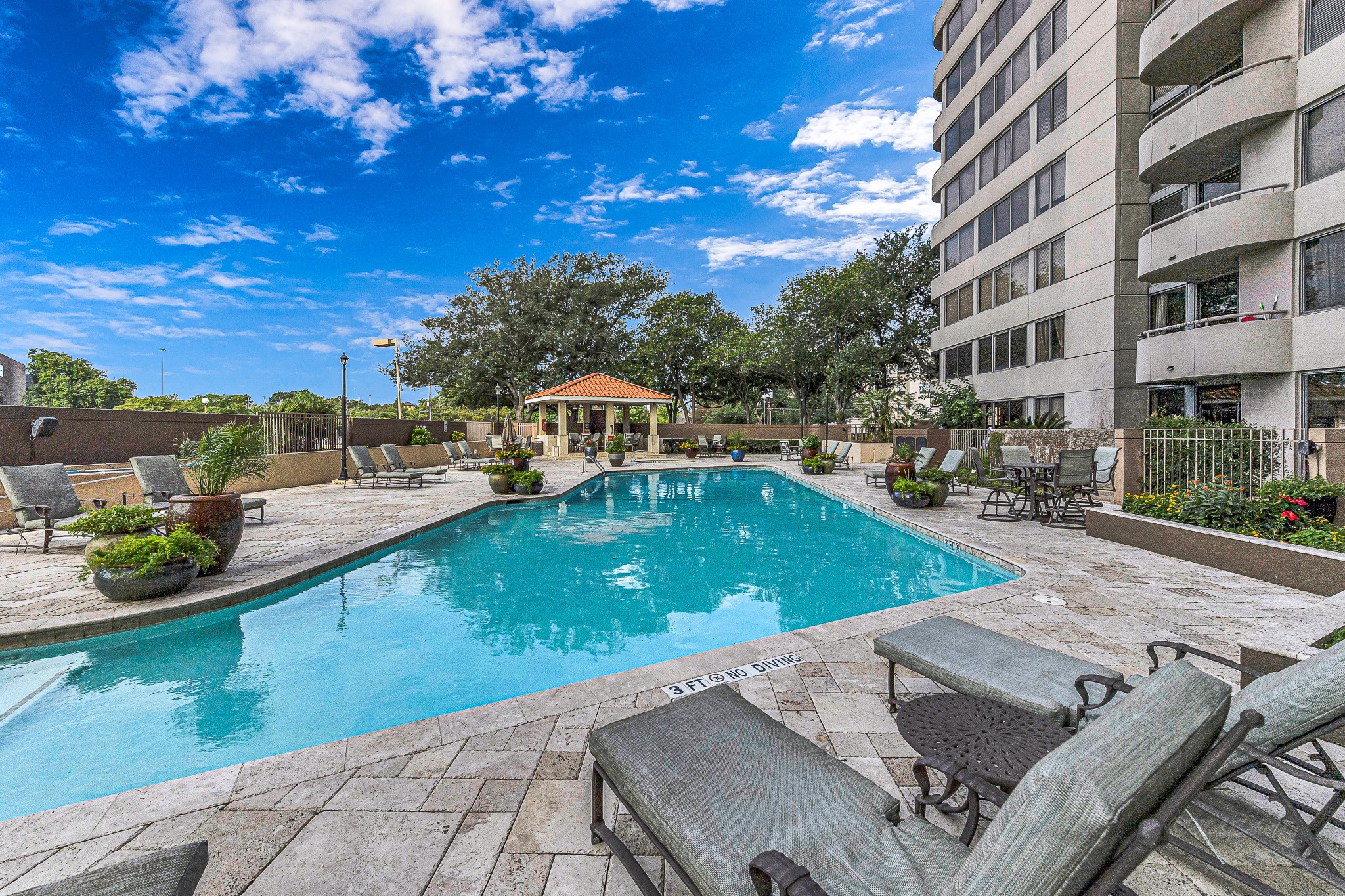 3525 Sage Road, Unit 1115 Houston, TX 77056 - Photo 40 of 47 Resort style pool with 2 outdoor kitchen areas