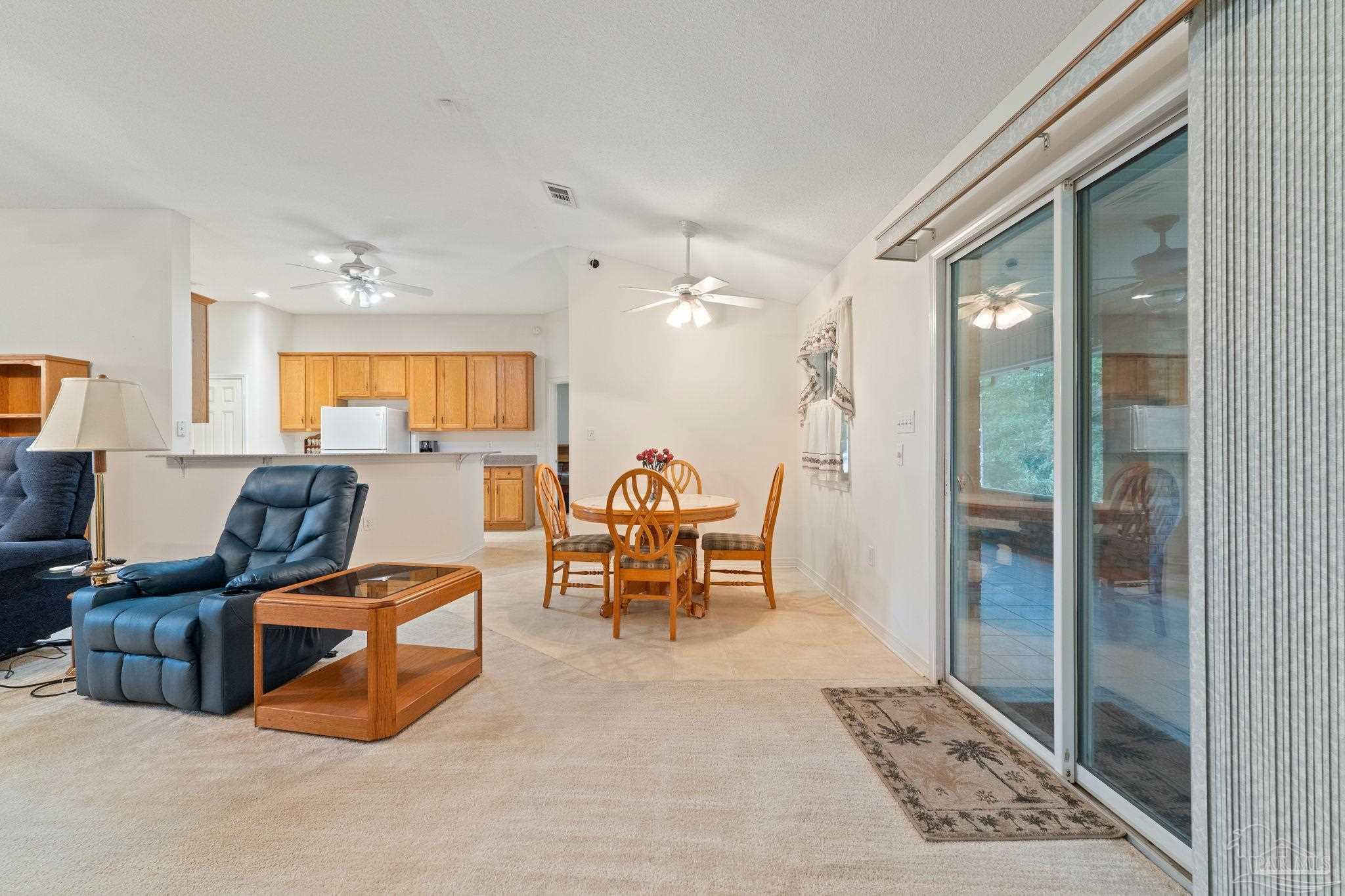 5073 Brookside Drive Pace, FL 32571 - Photo 13 of 38 a living room with furniture rug and window