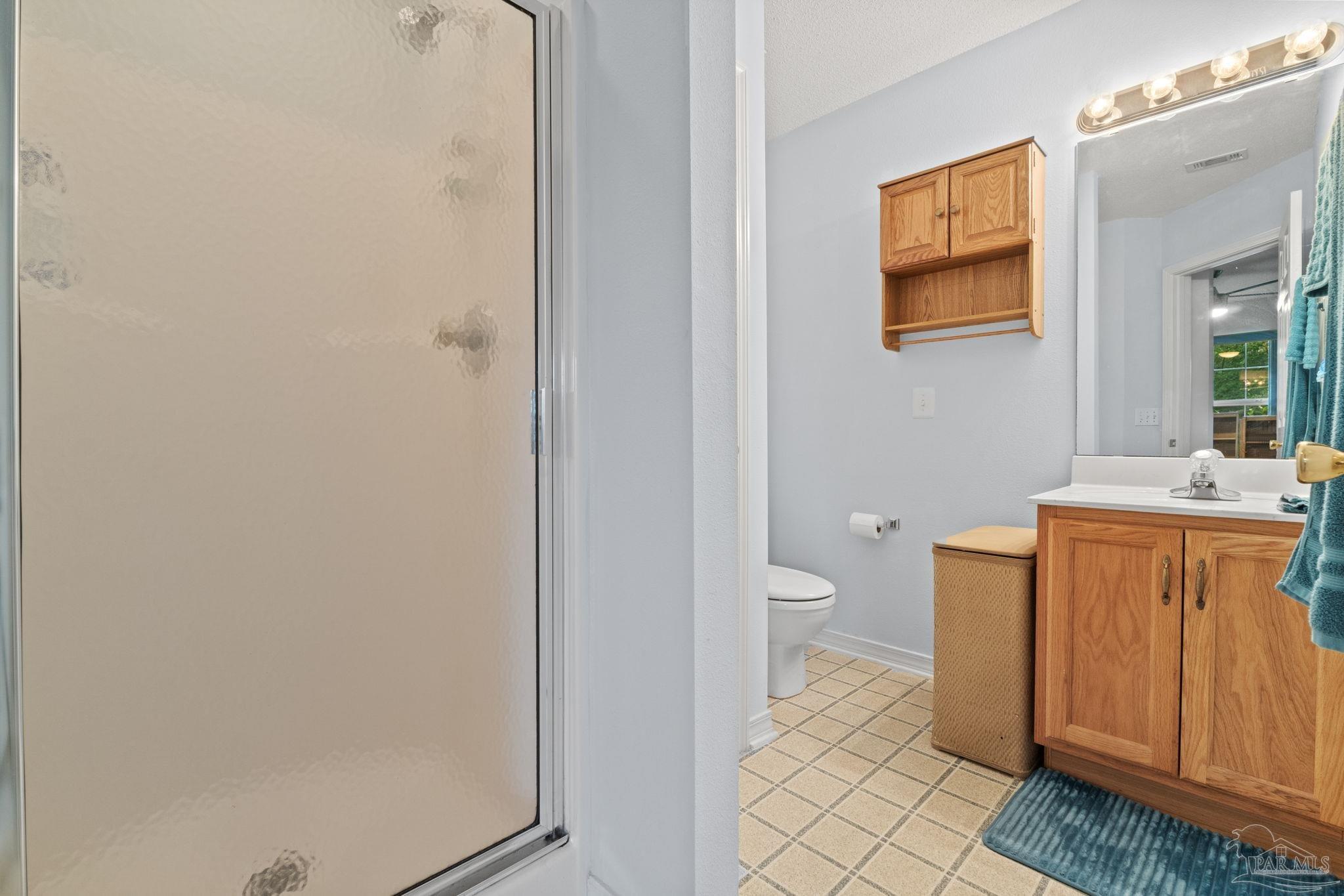 5073 Brookside Drive Pace, FL 32571 - Photo 18 of 38 a bathroom with a granite countertop sink and a mirror