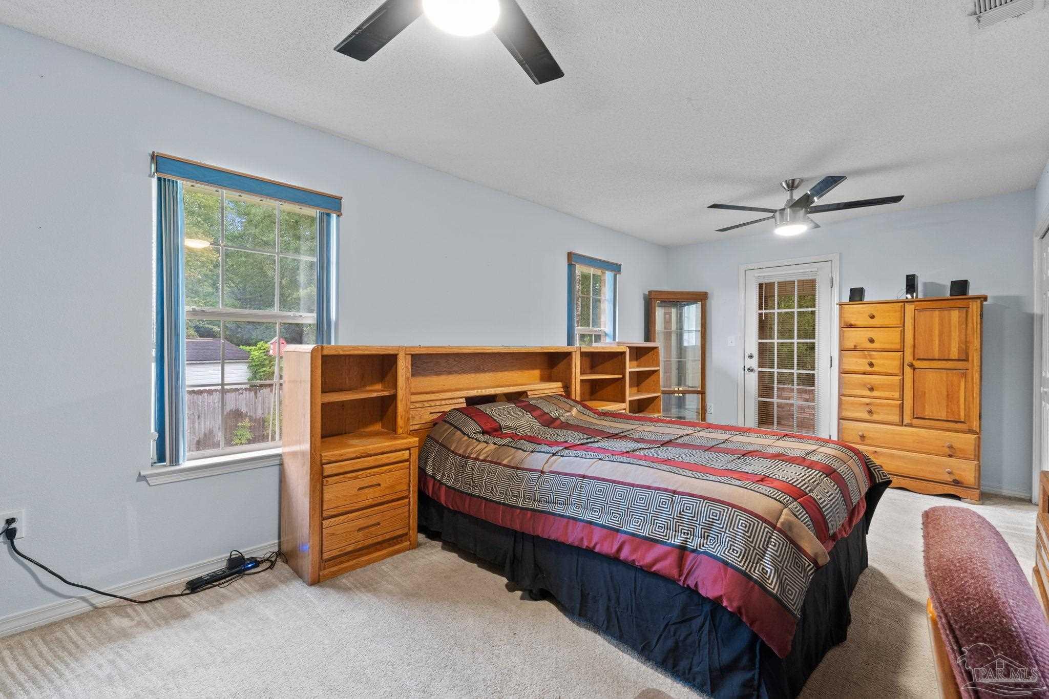 5073 Brookside Drive Pace, FL 32571 - Photo 30 of 38 a bedroom with a bed and a window