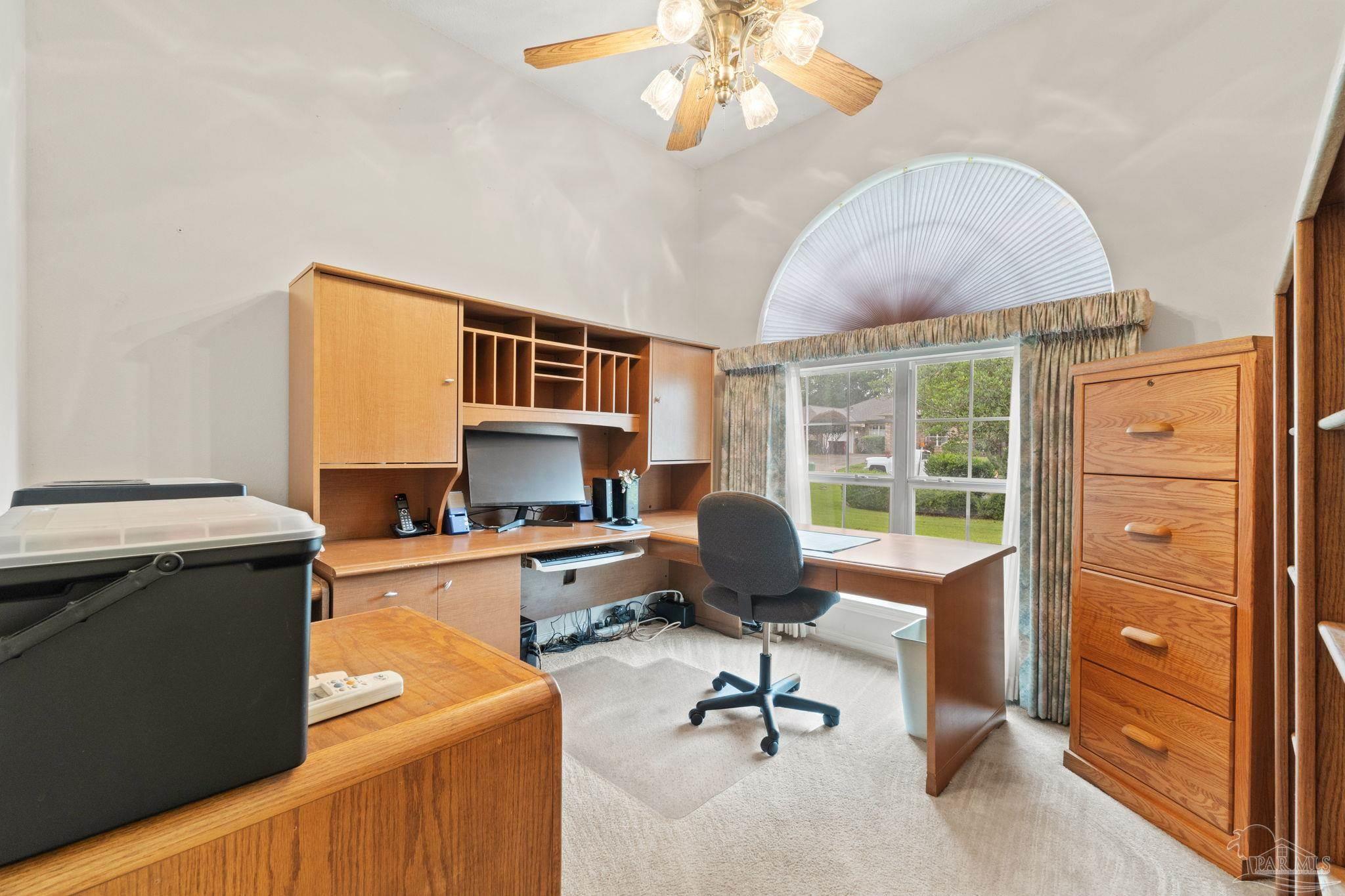 5073 Brookside Drive Pace, FL 32571 - Photo 4 of 38 a view of a workspace with furniture and a window