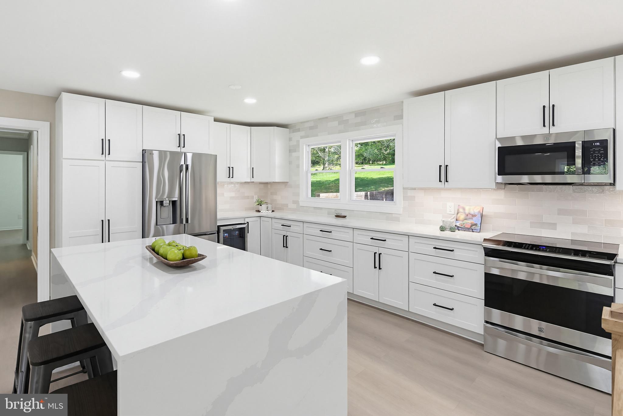 6702 Whitegate Road Clarksville, MD 21029 - Photo 5 of 52 Modern kitchen with sleek finishes.