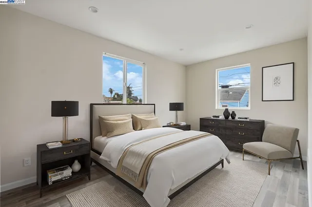 a bedroom with two beds and a couch