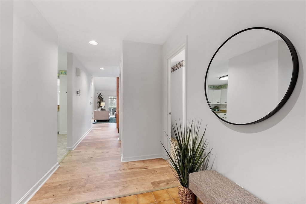 28 Monadnock Drive, Unit 28 Westford, MA 01886 - Photo 12 of 31 a view of a hallway with a potted plant